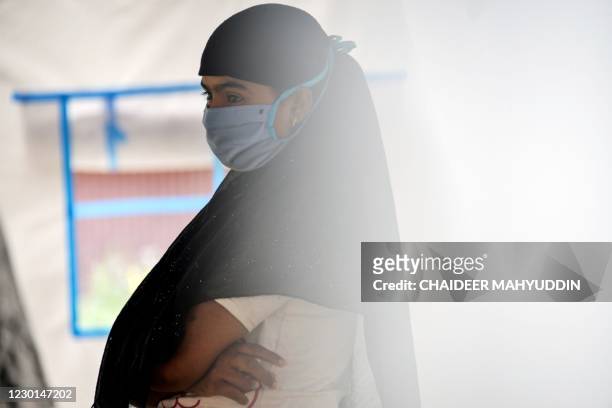 This photo taken on October 21, 2020 shows Rohingya refugee Janu whose family had arranged to marry a Rohingya man working as a labourer in Malaysia,...