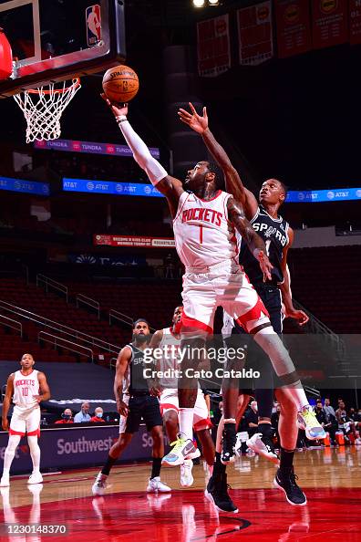 John Wal Rockets John Wall of the Houston Rockets drives to the basket against the San ...