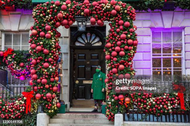 Doorman wearing a face mask as precaution against the spreading of covid-19 standing in front of Annabel's Club, Mayfair.