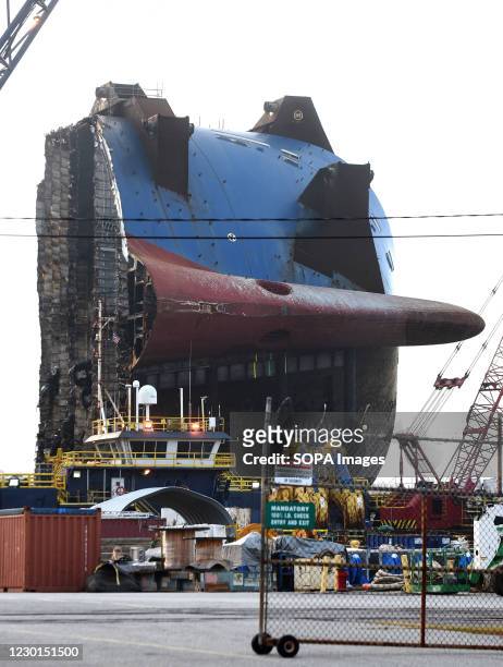 The bow section of the Golden Ray cargo ship sits on a barge after being cut from the car carrier and towed away. A salvage company is cutting the...