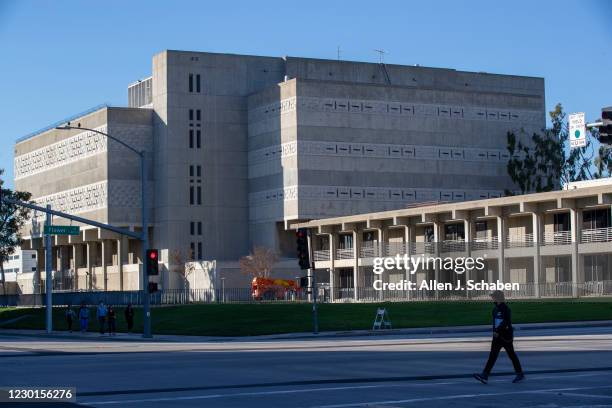 December 15: A pedestrian walks past the Orange County Jail and Orange County Sheriff's Department Headquarters, right, in Santa Ana Tuesday, Dec....