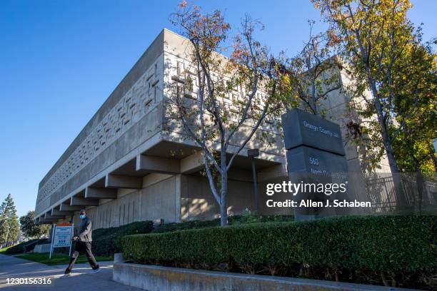 December 15: A pedestrian walks past the Orange County Jail in Santa Ana Tuesday, Dec. 15, 2020. An Orange County Superior Court judge ruled to halve...