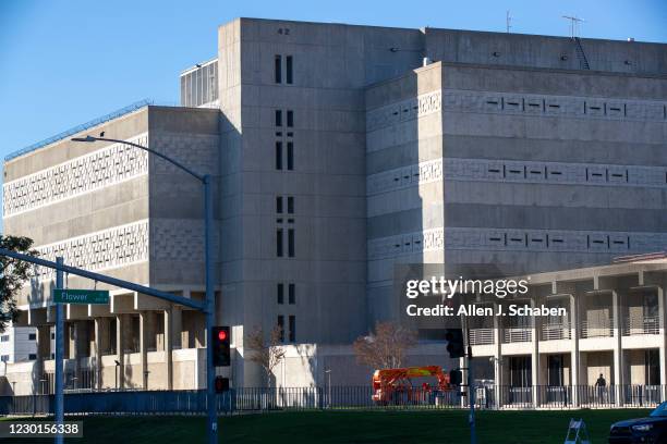 December 15: A pedestrian walks past the Orange County Jail and Orange County Sheriff's Department Headquarters, right, in Santa Ana Tuesday, Dec....