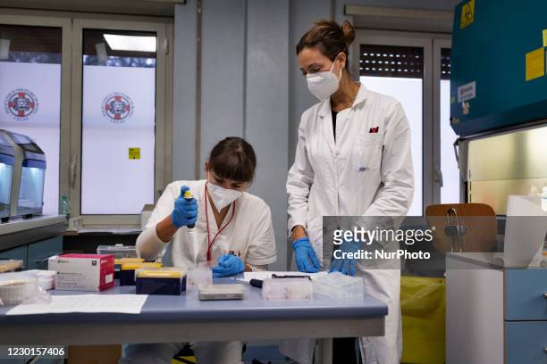Two biologists inside the laboratory of the Celio military hospital in Roma on 24th November 2020, Italy. Since the benning of the Covid-19 outbreak...
