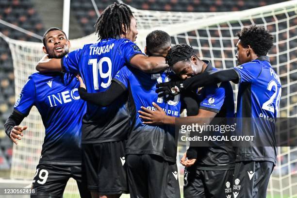 Nice's players react after scoring a goal during the French L1 football match between Nimes Olympique and OGC Nice , at the Costieres Stadium in...