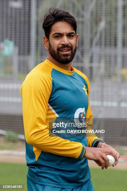 Pakistan's Haris Rauf gets ready to bowl during a training session at Eden Park in Auckland on December 17 ahead of the first T20 international...