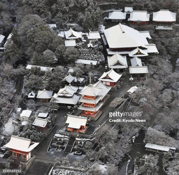 Photo taken Dec. 17 from a Kyodo News helicopter shows Kiyomizu temple in Kyoto, Japan, covered with snow for the first time this winter.