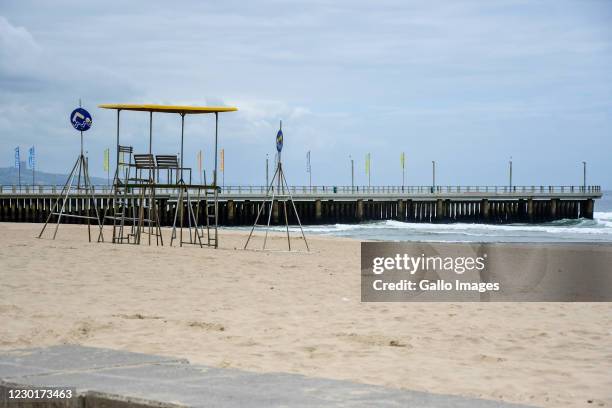 Empty beaches and lifeguard stand during beach closures on December 16, 2020 in Durban, South Africa. The beach promenade walk remained open. This...