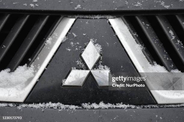 Mitsubishi logo seen on a parked car in Krakow city center. On Thursday, December 10 in Krakow, Poland.