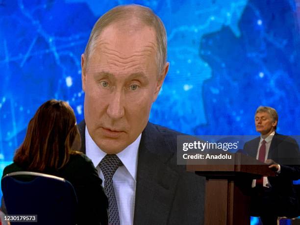 Members of press ask question during Russian President Vladimir Putin's annual press conference held via videoconference as capacity for participants...