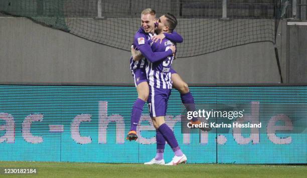 Florian Krueger celebrates the opening goal with Pascal Testroet of Aue during the Second Bundesliga match between FC Erzgebirge Aue and Karlsruher...