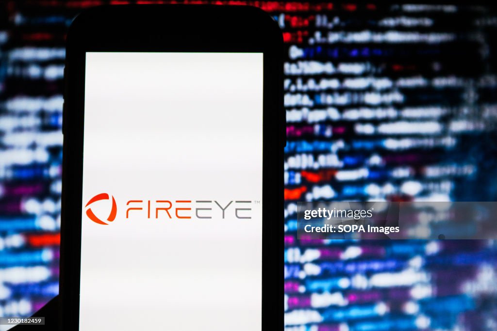 In this photo illustration a FireEye cyber security company...