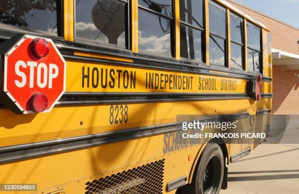 School bus is seen outside Condit Elementary School in Bellaire, outside Houston, Texas, on December 16, 2020. - The coronavirus pandemic may be...