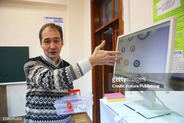 Head of the Biomedical Engineering Department, PhD in technical sciences Oleh Avrunin shows a laparoscopic surgical simulator in an educational...