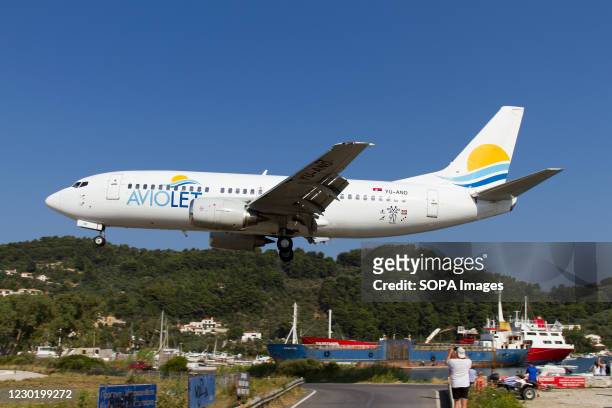 An Aviolet Boeing 737-300 lands at Skiathos airport.