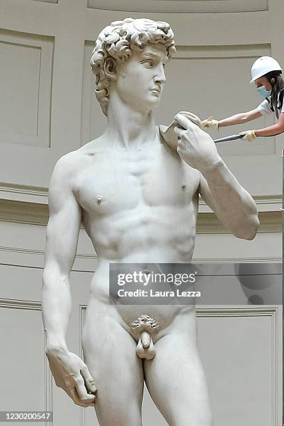 Restorer cleans Michelangelo's David statue while preparing for the reopening of the Galleria dell'Accademia which was closed for almost three months...