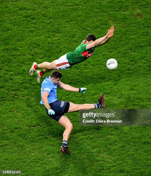 Dublin , Ireland - 19 December 2020; Brian Howard of Dublin in action against Lee Keegan of Mayo during the GAA Football All-Ireland Senior...