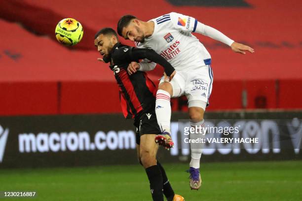 Nice's French forward Alexis Claude-Maurice fights for the ball with Lyon's French midfielder Houssem Aouar during the French L1 football match...