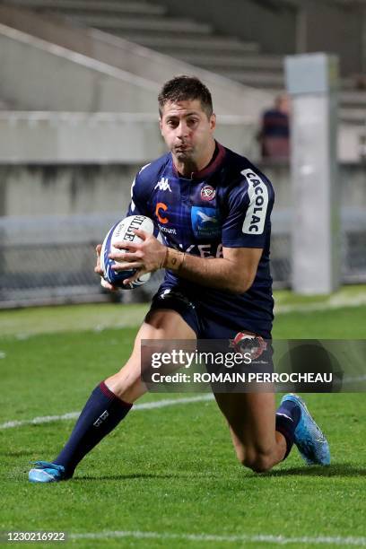Bordeaux' Argentinian wing Santiago Cordero plays the ball during the European Rugby Champions Cup rugby union match between Union Bordeaux Begles...