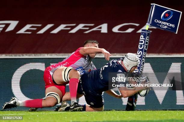 Bordeaux' French hook Maxime Lamothe dives across the line to score a try during the European Rugby Champions Cup rugby union match between Union...