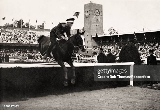 Charles von Roummel of Russia riding Siablik in the individual show-jumping competition during the Summer Olympic Games in Stockholm, Sweden on 16th...