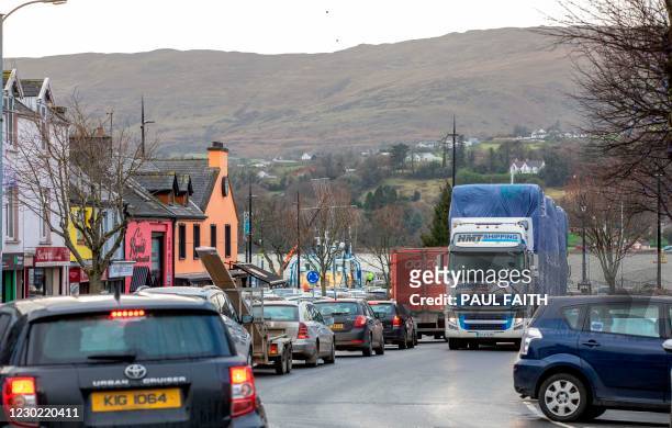 Freight lorry passes through the border town of Warrenpoint, sitting beside Carlingford lough, with Northern Ireland on one side and the Irish...