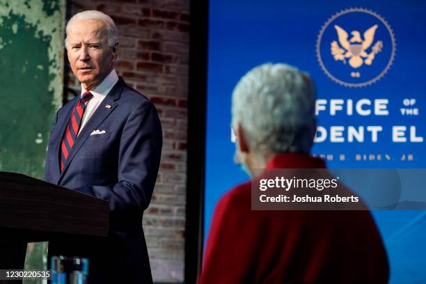 President-elect Joe Biden looks towards appointee for National Climate Advisor, Gina McCarthy, as he announces members of his climate and energy...