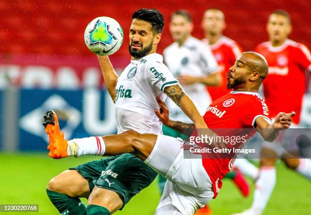 Luan Garcia of Palmeiras and Patrick of Internacional fight for the ball during the match between Internacional and Palmeiras as part of Brasileirao...