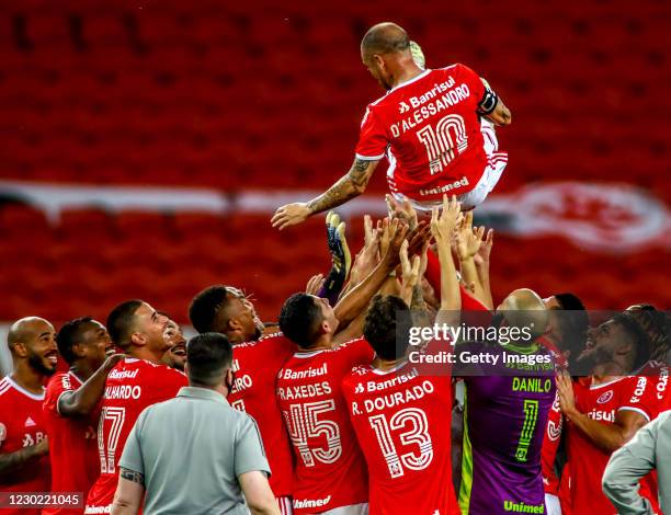 Teammates throw Andrés D'Alessandro Of Internacional after his last match in the club against Palmeiras as part of Brasileirao Series A 2020 at Beira...