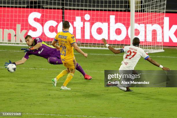 Nahuel Guzman of Tigres UANL makes a diving save on a shot by Jerry Bengston of CD Olimpia as Jesus Duenas of Tigres UANL looks on during the...