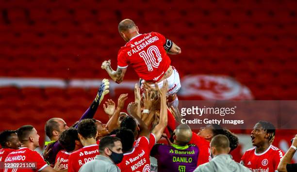 Teammates throw Andrés D'Alessandro Of Internacional after his last match in the club against Palmeiras as part of Brasileirao Series A 2020 at Beira...