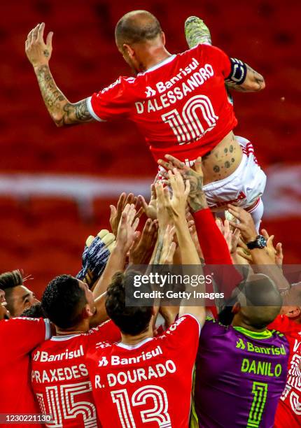 Teammates throw Andrés D'Alessandro Of Internacional after his last match in the club against Palmeiras as part of Brasileirao Series A 2020 at Beira...