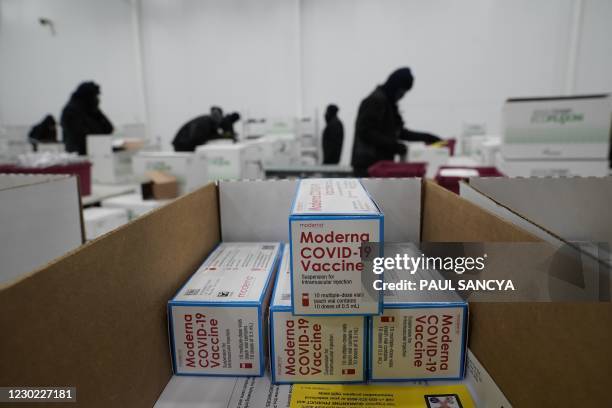 Boxes containing the Moderna Covid-19 vaccine are prepared to be shipped at the McKesson distribution center in Olive Branch, Mississippi, on...