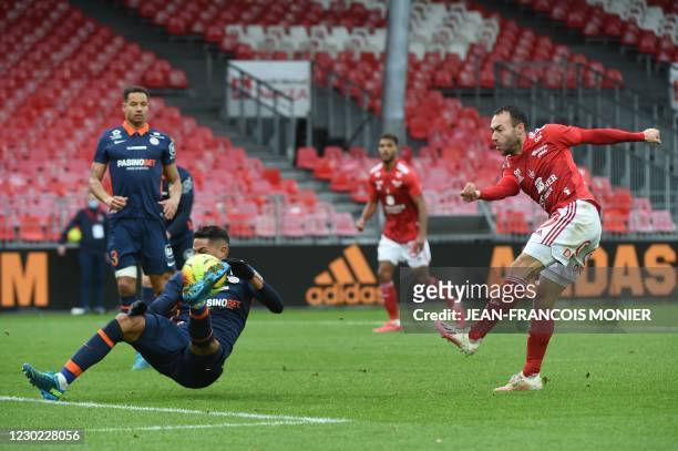 Brest's French midfielder Romain Philippoteaux scores a goal despite Montpellier's Portuguese defender Pedro Mendes during the French L1 Football...