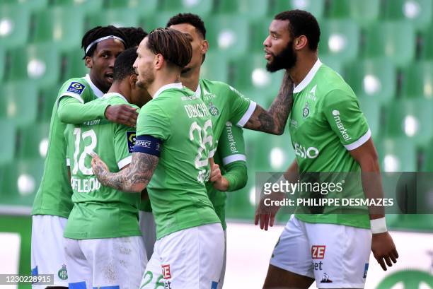 Saint-Etienne's French defender Harold Moukoudi is congratuled by team mates after scoring a goal during the French L1 football match between AS...