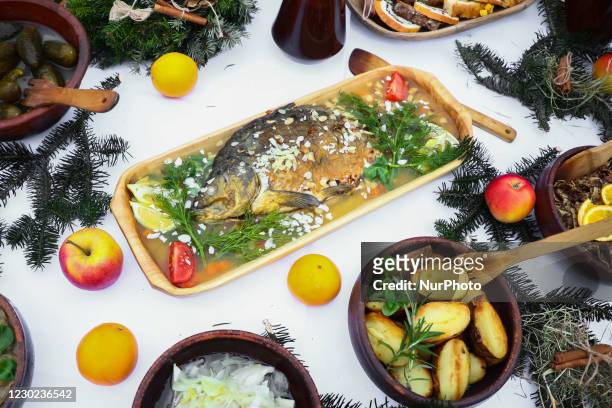Traditional jellied carp and other Polish Christmas dishes are presented at the Main Square during the 24th edition of the Christmas Eve for poor and...