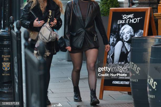 An advertising for hot drinks with an image of Marilyn Monroe seen outside a pub in Dublin's Temple Bar. On Sunday, December 20 in Dublin, Ireland.