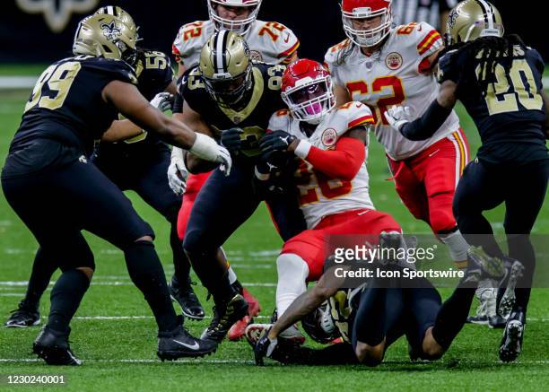 Kansas City Chiefs running back Le'Veon Bell is tackled but New Orleans Saints defensive tackle David Onyemata on December 20, 2020 at the...