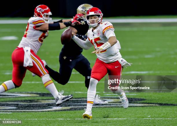 Kansas City Chiefs quarterback Patrick Mahomes scrambles to pass the ball against New Orleans Saints on December 20, 2020 at the Mercedes-Benz...