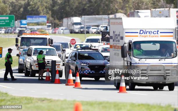 Long queue of motorists who are entering Queensland from New South Wales through the border checkpoint on December 21, 2020 in Coolangatta, Gold...