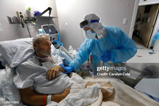 Houston, TexasDec. 9, 2020Covid-19 patient Charles Fletcher cant talk because of the hole in his throat and tracheotomy collar, but he mouthed words...