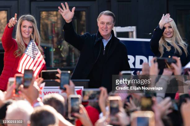 Ivanka Trump and Senators Kelly Loeffler and David Perdue wave to the crowd at a campaign event on December 21, 2020 in Milton, Georgia. The two...