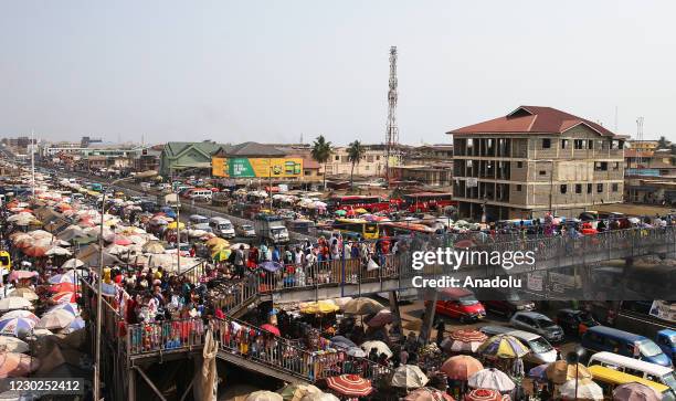 People shop at busy Kaneshi Market amid coronavirus in Accra, Ghana on December 21, 2020.