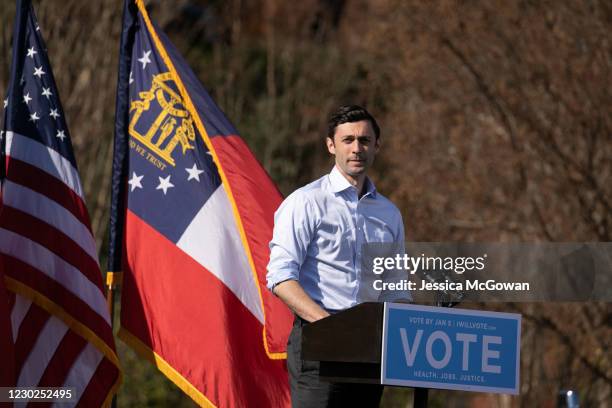 Georgia Democratic Senate candidate Jon Ossoff addresses the crowd during a drive-in rally at Bibb Mill Event Center on December 21, 2020 in...