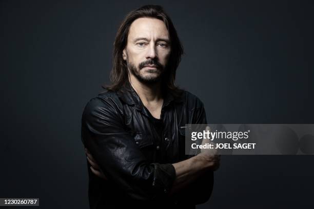 French producer and house music DJ Christophe Le Friant, known as Bob Sinclar, poses in his studio in Paris on May 14, 2020.