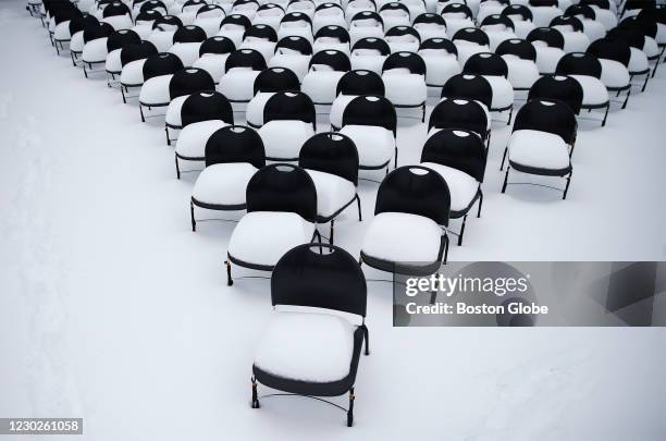 Who were lost to COVID-19 are covered in snow on the lawn in front of Newton City Hall they comprise a City of Newton COVID-19 Remembrance in Newton,...