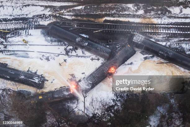 In this aerial view from a drone, a train carrying crude oil burns while derailed on December 22, 2020 in Custer, Washington. BNSF Railway Company...