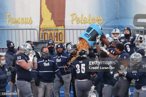 The Nevada Wolf Pack celebrates with a traditional french fry bath during second half action against the Tulane Green Wave at the Famous Idaho Potato...