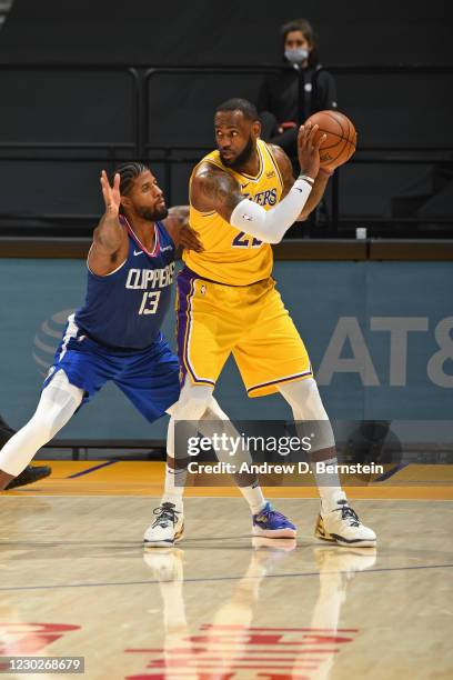 Paul George of the LA Clippers plays defense on LeBron James of the Los Angeles Lakers on December 22, 2020 at STAPLES Center in Los Angeles,...