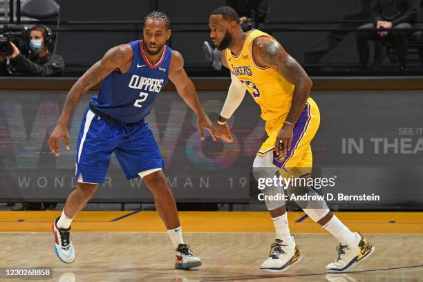 Kawhi Leonard of the LA Clippers and LeBron James of the Los Angeles Lakers stand on the court on December 22, 2020 at STAPLES Center in Los Angeles,...